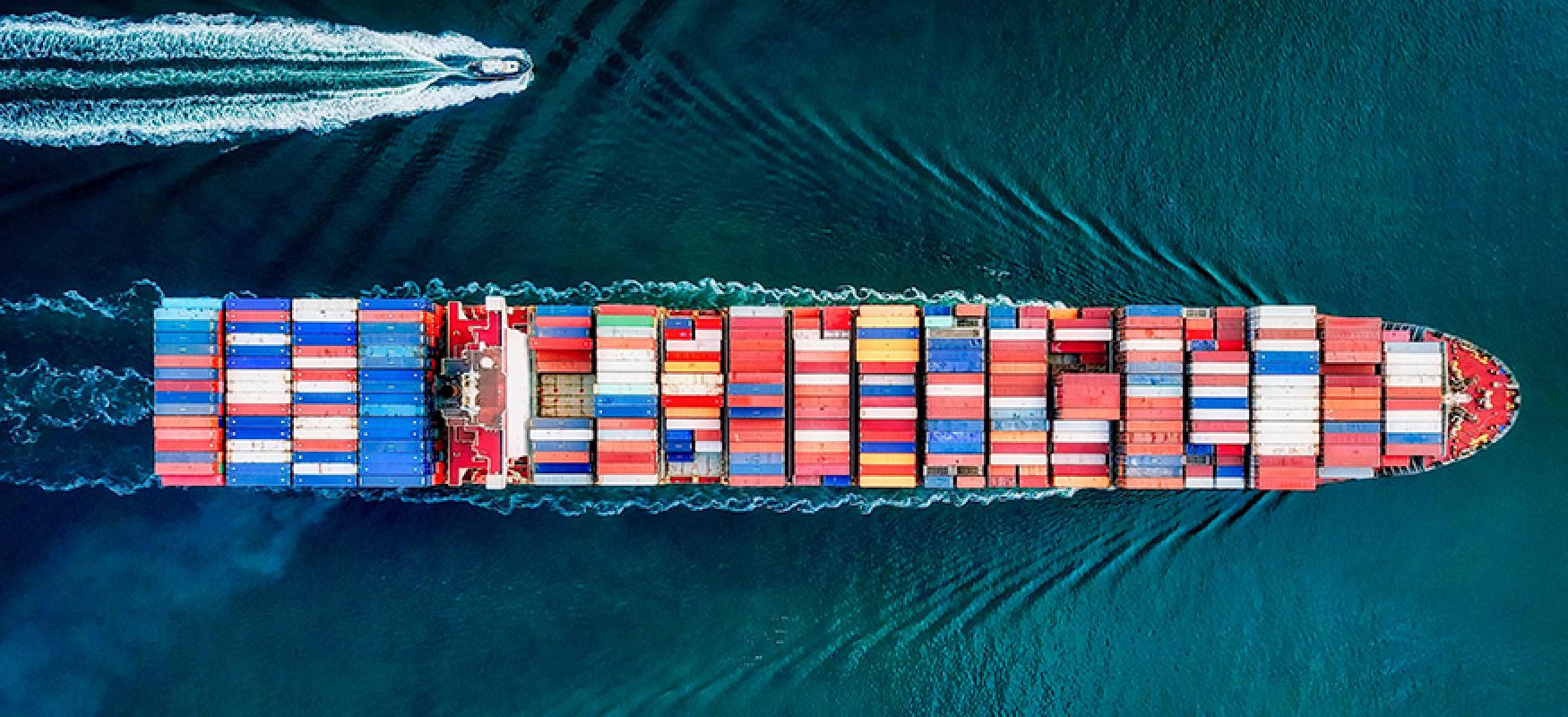 Container vessel underway on open blue water